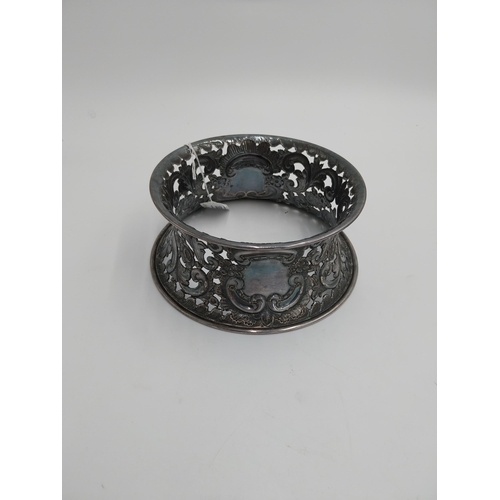 1363 - White metal dish ring / potato ring, with pierced scroll, floral decoration and two vacant cartouche... 