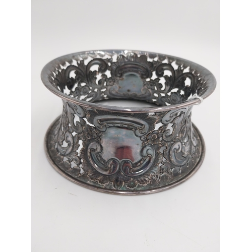 1363 - White metal dish ring / potato ring, with pierced scroll, floral decoration and two vacant cartouche... 