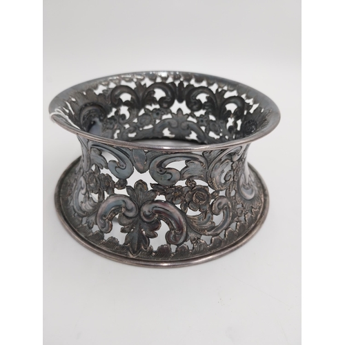 1363 - White metal dish ring / potato ring, with pierced scroll, floral decoration and two vacant cartouche... 