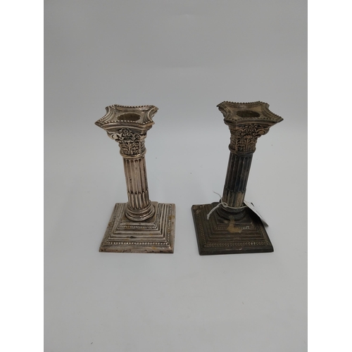 1364 - Pair of English packed silver Corinthian column candlesticks. Hallmarked in Birmingham 1909. Maker W... 