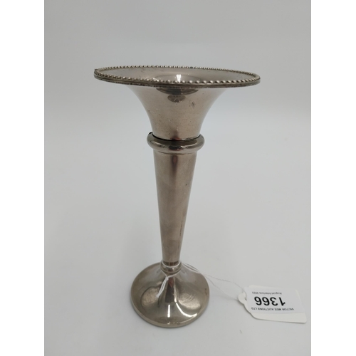 1366 - Silver plated bud vase, the tapered plain body with gadroon rim and flat base.