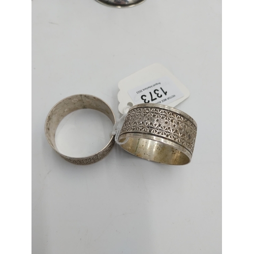 1373 - Three English silver napkin rings. Hallmarked in Birmingham 1902. Makers mark unclear Wt: 54grs. { 2... 