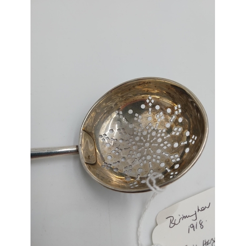 1374 - English silver tea strainer. Hallmarked in Birmingham 1918. Maker T H Hazelwood & Co. Wt: 24grs. { 1... 