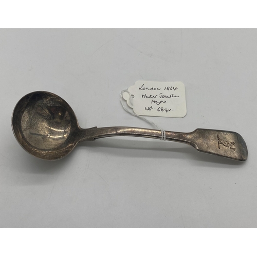 1393 - English silver sauce ladle. Hallmarked in London 1864. Maker Jonathan Hayne. Wt: 68grs. { 18cm L }.