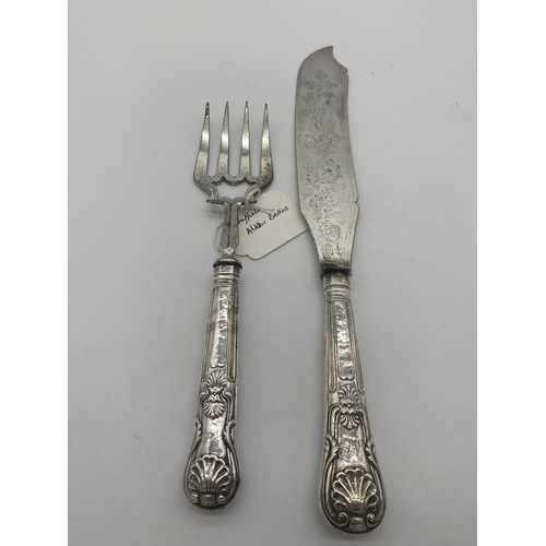 1396 - Kings Pattern fish knife and fork serving set with English silver handles. Hallmarked in Sheffield M... 