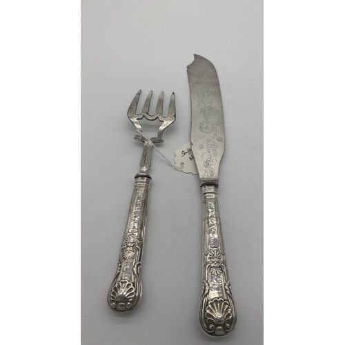 1396 - Kings Pattern fish knife and fork serving set with English silver handles. Hallmarked in Sheffield M... 