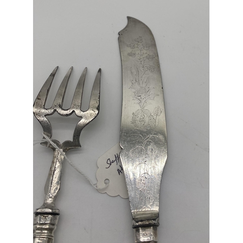 1396 - Kings Pattern fish knife and fork serving set with English silver handles. Hallmarked in Sheffield M... 