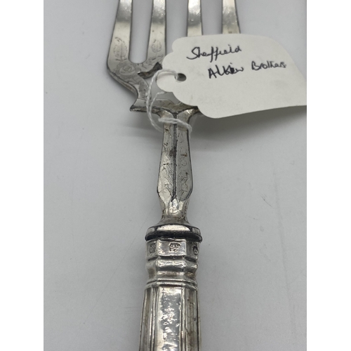 1396 - Kings Pattern fish knife and fork serving set with English silver handles. Hallmarked in Sheffield M... 