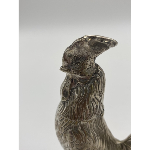 1420 - Silver pepper pot in the form of a rooster. Hallmarks rubbed. Wt: 169grs. { 15cm H X 10cm W X 7.5cm ... 