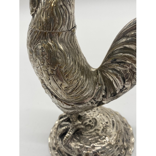 1420 - Silver pepper pot in the form of a rooster. Hallmarks rubbed. Wt: 169grs. { 15cm H X 10cm W X 7.5cm ... 