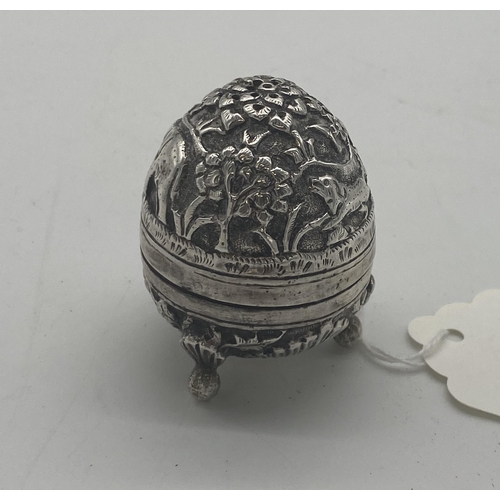 1421 - White metal pepper pot decorated with foliage, elephants and dogs. Wt: 32grs. { 5cm H X 4cm Dia }.