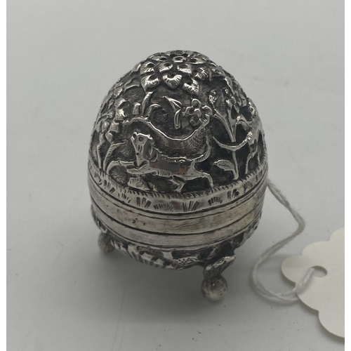 1421 - White metal pepper pot decorated with foliage, elephants and dogs. Wt: 32grs. { 5cm H X 4cm Dia }.