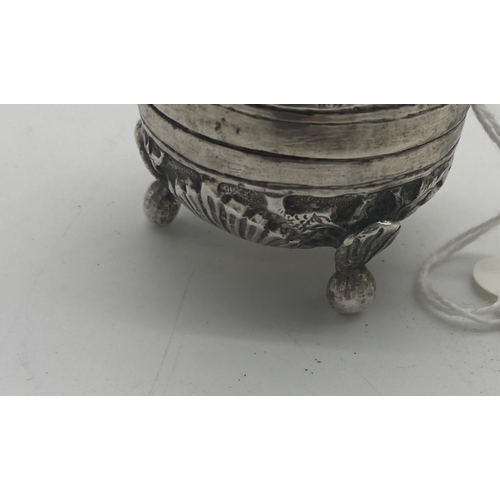 1421 - White metal pepper pot decorated with foliage, elephants and dogs. Wt: 32grs. { 5cm H X 4cm Dia }.