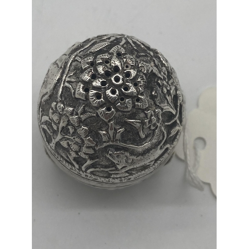 1421 - White metal pepper pot decorated with foliage, elephants and dogs. Wt: 32grs. { 5cm H X 4cm Dia }.