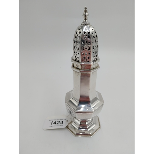 1424 - English silver sugar sifter/ shaker, the dome top of push fit and pierced design surmounted with a f... 