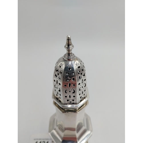 1424 - English silver sugar sifter/ shaker, the dome top of push fit and pierced design surmounted with a f... 