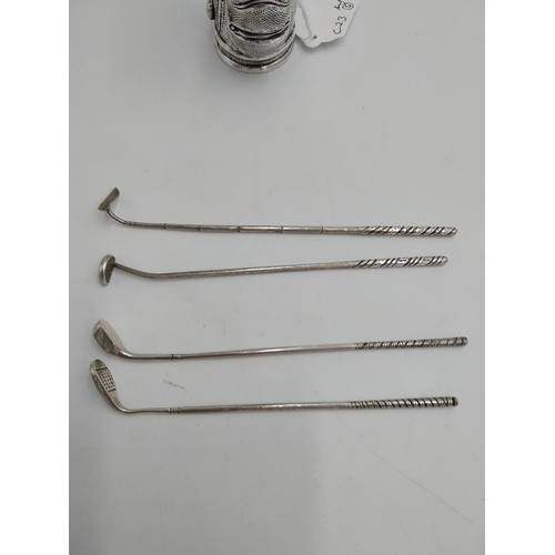 1427 - English silver model of a golf bag & four golf clubs. Hallmarked in Exeter. Markers mark J B W. Wt: ... 