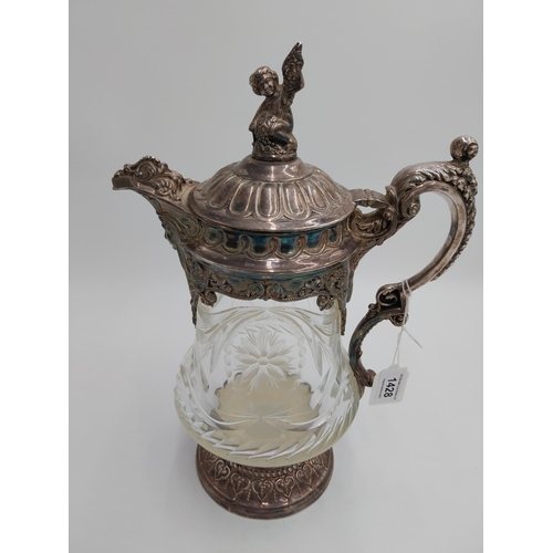 1428 - Large 19th. C. silver plated and cut glass claret jug, the glass body decorated with floral motif an... 