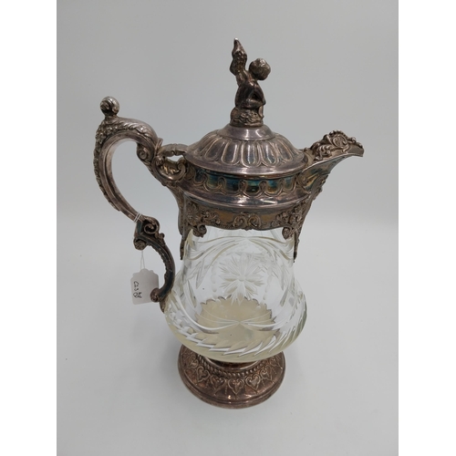 1428 - Large 19th. C. silver plated and cut glass claret jug, the glass body decorated with floral motif an... 