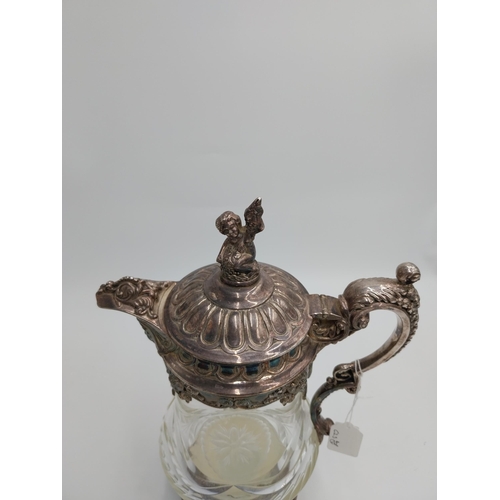 1428 - Large 19th. C. silver plated and cut glass claret jug, the glass body decorated with floral motif an... 