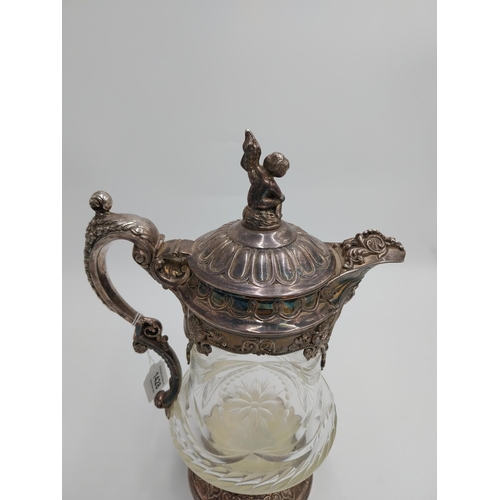 1428 - Large 19th. C. silver plated and cut glass claret jug, the glass body decorated with floral motif an... 