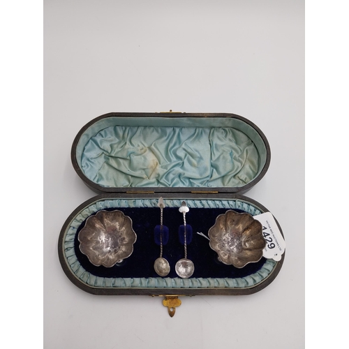 1429 - English silver pair of salts and spoons, the salts of floral form, raised on three ball feet, the sp... 