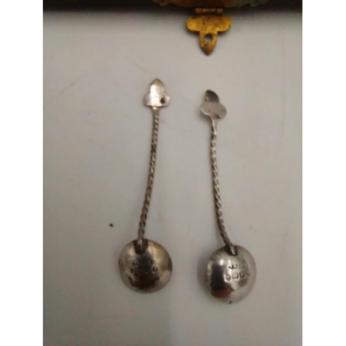 1429 - English silver pair of salts and spoons, the salts of floral form, raised on three ball feet, the sp... 