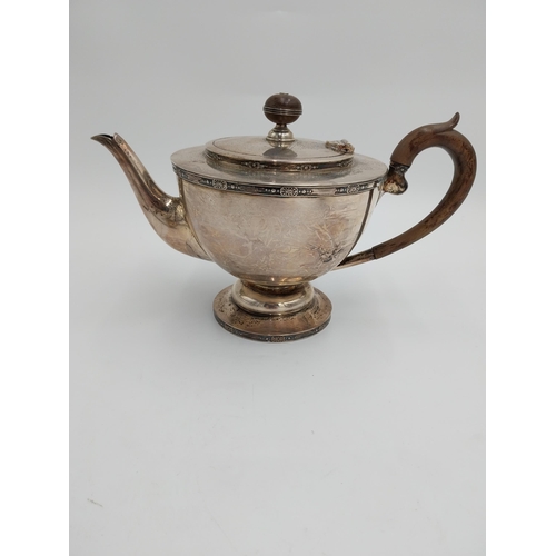 1430 - English silver three piece tea service, teapot with hinged cover, wooden finial and  handle, twin ha... 