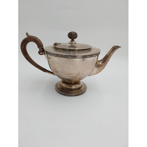 1430 - English silver three piece tea service, teapot with hinged cover, wooden finial and  handle, twin ha... 