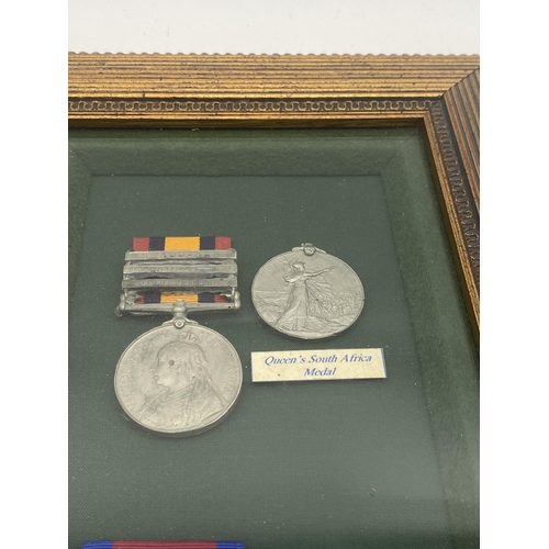 1431 - Set of replica Waterloo & Queen's South Africa medals with ribbons mounted in a glazed case.