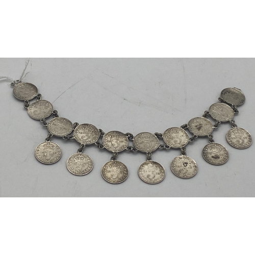 1455 - Ladies bracelet made from sixteen  George V & one Victorian 3d. pieces.