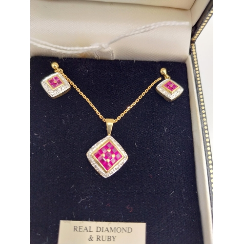 1471 - 9 carat gold pendant and pair of earrings set with rubies and diamonds, in presentation box.