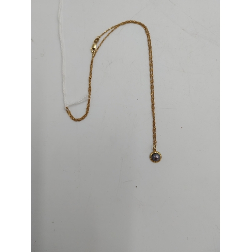 1478 - 14 carat gold { stamped 585 } chain and pendant, the pedant inset with a grey coloured stone.