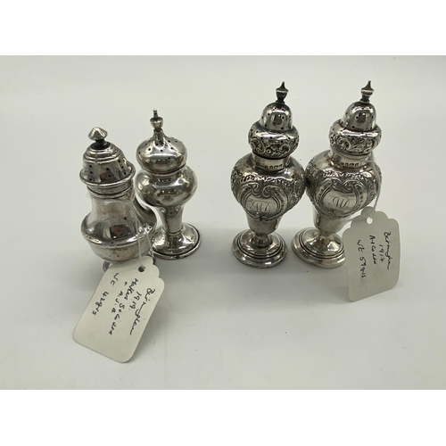 1401 - Pair of English silver salt & pepper pots, the cartouche monogrammed MD. Hallmarked in Birmingham 19... 