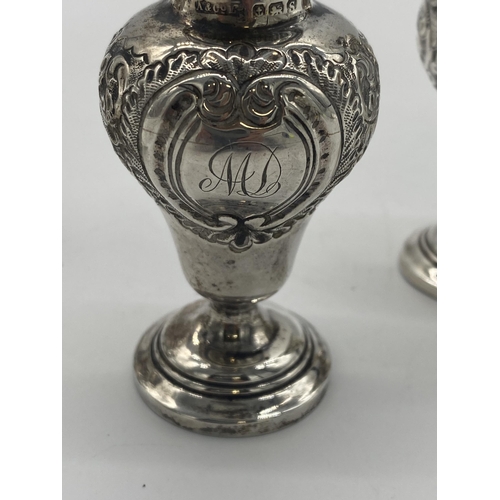 1401 - Pair of English silver salt & pepper pots, the cartouche monogrammed MD. Hallmarked in Birmingham 19... 