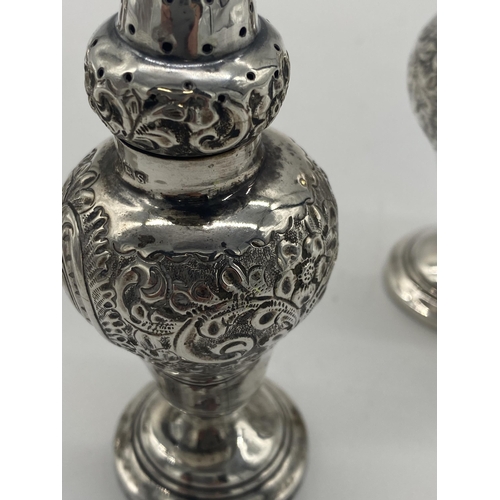 1401 - Pair of English silver salt & pepper pots, the cartouche monogrammed MD. Hallmarked in Birmingham 19... 