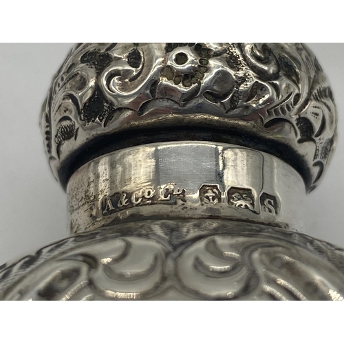 1401 - Pair of English silver salt & pepper pots, the cartouche monogrammed MD. Hallmarked in Birmingham 19... 