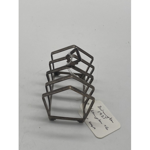 1410 - English silver toast rack Hallmarked in Birmingham 1938 Maker  Barker Brothers Ltd. Wt: 196grs. { 13... 