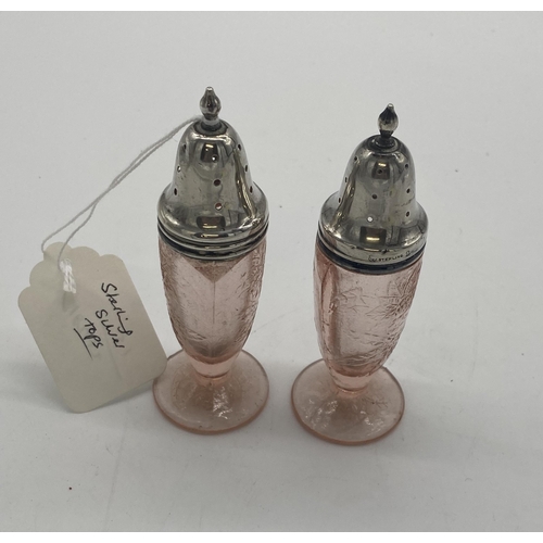 1411 - Pair of moulded glass pepper pots with sterling silver tops. { 12cm H X 4cm Dia }.