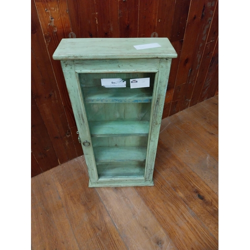 106 - Painted pine wall mounted cabinet with single glazed door {81 cm H x 40 cm W x 15 cm D}.