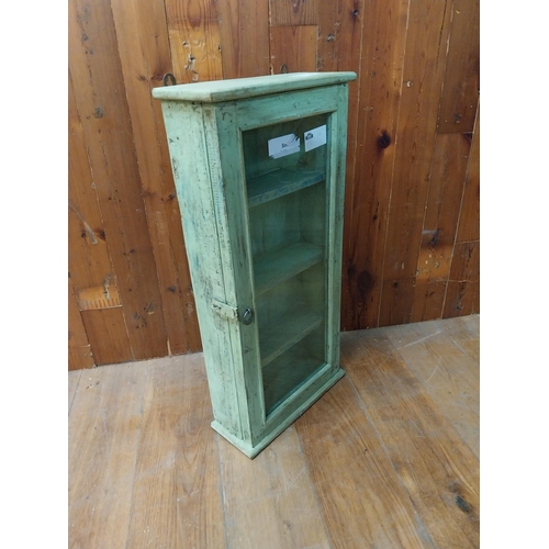 106 - Painted pine wall mounted cabinet with single glazed door {81 cm H x 40 cm W x 15 cm D}.