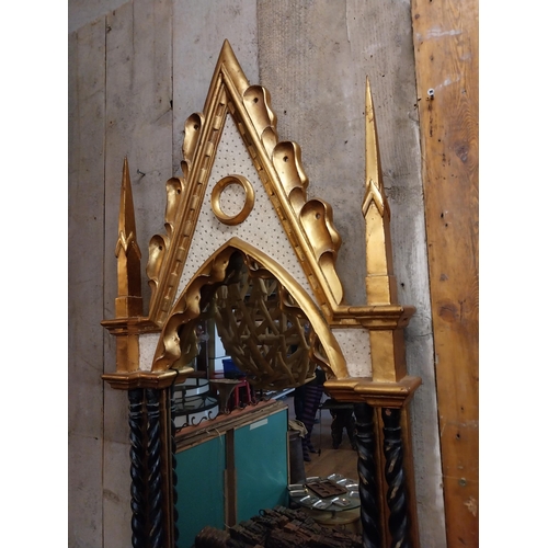 111 - Decorative gilt wall mirror in the Gothic style {146 cm H x 57 cm W}.