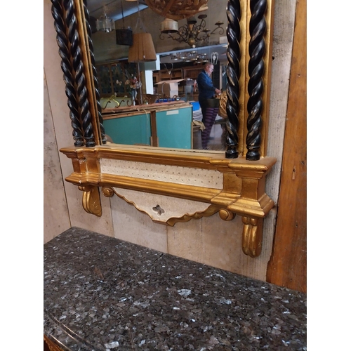 111 - Decorative gilt wall mirror in the Gothic style {146 cm H x 57 cm W}.