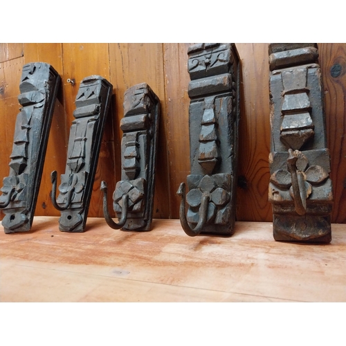 122 - Collection of six carved hardwood wall mounted coat hangers {Approx. 28 cm H x 8 cm W x 10 cm D}.