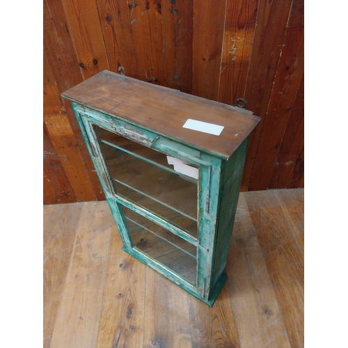 127 - Painted hardwood wall cabinet with single glazed door {89 cm H x 53 cm W x 18 cm D}.