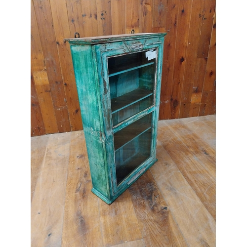 127 - Painted hardwood wall cabinet with single glazed door {89 cm H x 53 cm W x 18 cm D}.