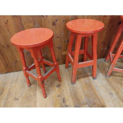 129 - Collection of four Irish painted pine bar - pub stools {Approx. 80 cm H x 40 cm W x 40 cm D}.