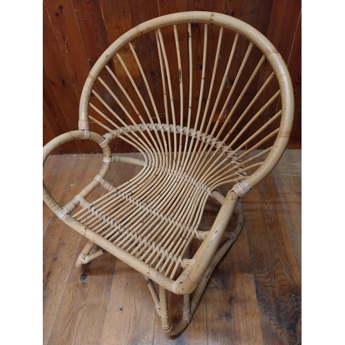 130 - Retro wicker armchair {84 cm H x 72 cm W x 67 cm D}.