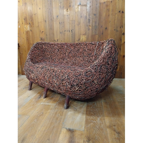 143 - Unusual wicker two seater sofa {80 cm H x 160 cm W x 80 cm D}.