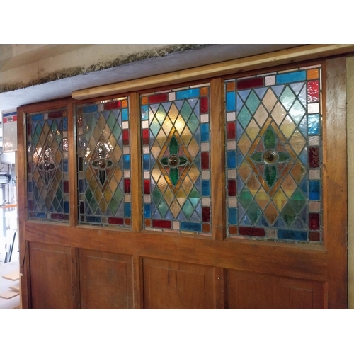 146 - 19th C. mahogany panel with four stained glass panels {208 cm H x 222 cm W x 5 cm D}.